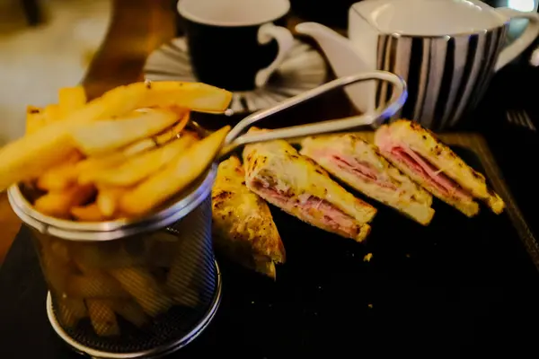 Roasted sandwich and fries. A dinner set. Food concept.
