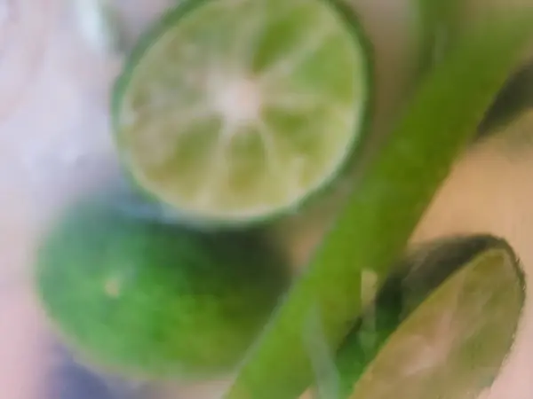 Close-up of the lime in the cold water. Food and drink concept.