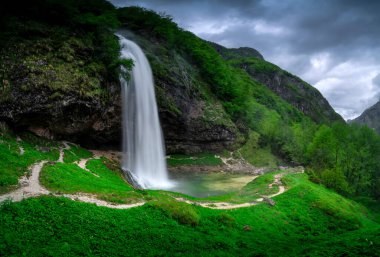 Postcard from Italy. Goriuda waterfall (Fontanone di Goriuda), friuli venezia giulia, Northern Italy. clipart