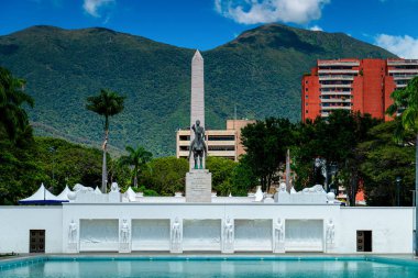 Close-up of the Paseo Los Proceres monument in Caracas, Venezuela. Mountains in the background of the municipal building. clipart