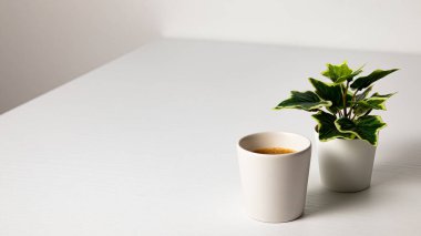 cup of coffee and a white mug on the table. place for your text, concept.