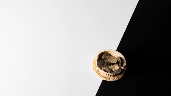 stock image gold and silvers coins on a white and black background, top view