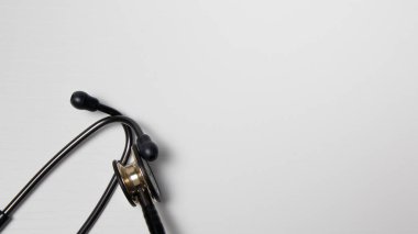 stethoscope and headphones on white background