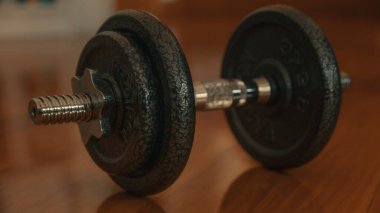 dumbbells on a wooden background