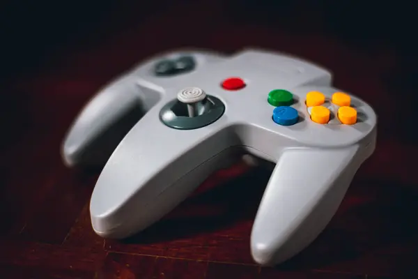 video game controller on a dark background. retro style toned picture