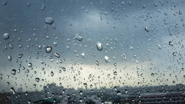 rain drop on glass in raining day