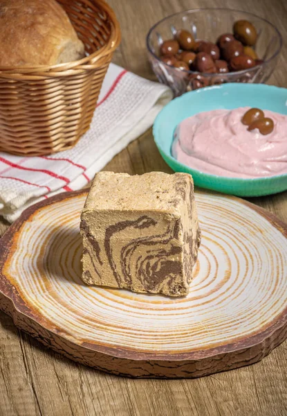 chocolate Greek halva with some fasting food like taramosalata,  bread and olives