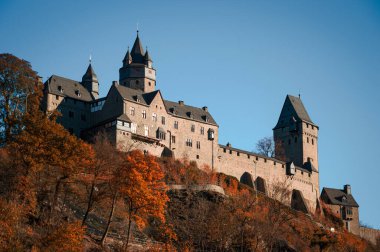 Altena Castle Burg Altena in Sauerland Germany is a famous Landmark monument in the Lenne Valley and Mediaval Sight with First Youth Hostel of the World on a sunny colorful autumn day