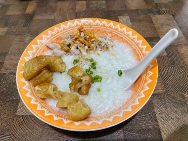 Bubur Ayam or Chicken Porridge, Served with Cakwe Shreded Chicken and Chili Oil