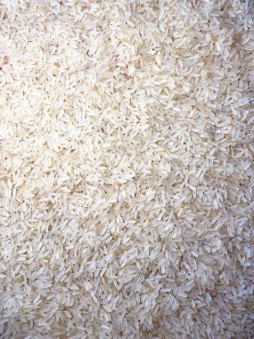 Kuru Pişmemiş Beyaz Pirinç Arkaplanı - Üst Manzara, Düz Yat. Çiğ Uzun Taneli Pirinç. Asya mutfağı ve kültürü. Sağlıklı beslenme malzemeleri. Diyet Yemekler