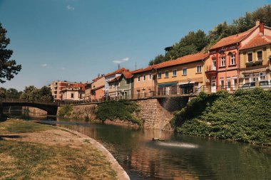 Knjazevac embankment with historical buildings and bridge on Timok river. Downtown and stone promenade are popular landmarks and touristic attractions. Knjazevac old town, Balkans travel destination.