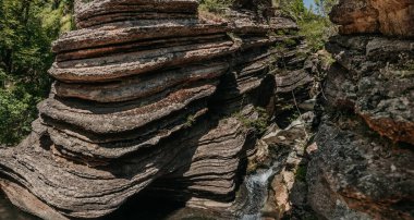 Rosomaca Pots canyon in Balkan Mountains. Panorama of ancient gorge of Rosomaca river valley, natural site with limestone rocks and waterfalls. Unique attraction of Serbia, Balkan travel destination.