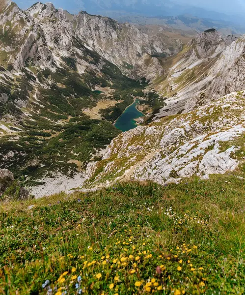 stock image Aerial panorama from Bobotov Kuk mountain peak. Alpine summer landscape with Skrcko lake and green valley in Durmitor National Park. Peaks of Balkans adventurous trekking route through Montenegro.