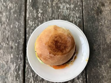 Close up of the homemade burger on white plate 