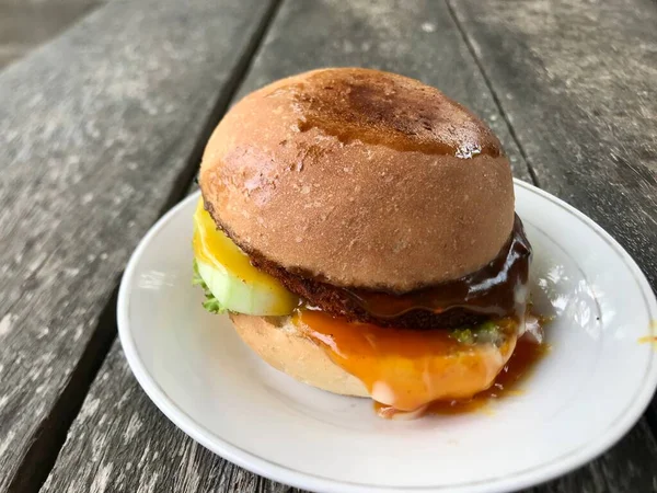 Close up of the homemade burger on white plate 