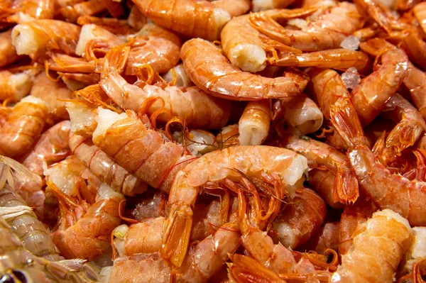 fresh orange shrimps on the table in the fish market