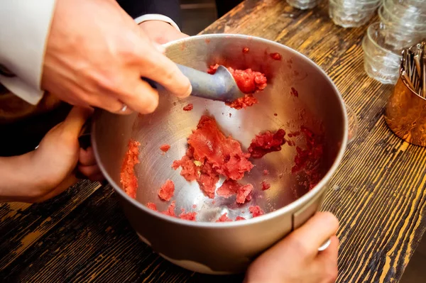 making ice cream with liquid nitrogen female hands holding a bowl in fumes