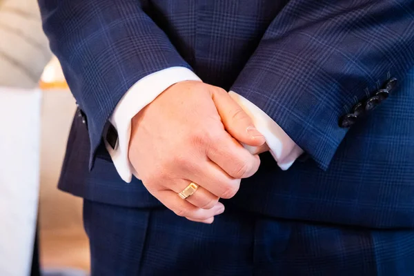 hands, wedding rings and marriage vows hands of the groom with a wedding ring after the marriage vows