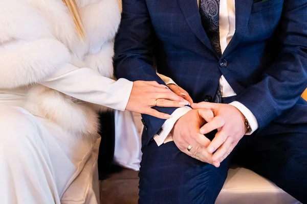 hands, wedding rings and marriage vows young couple holding hands after taking marriage vows