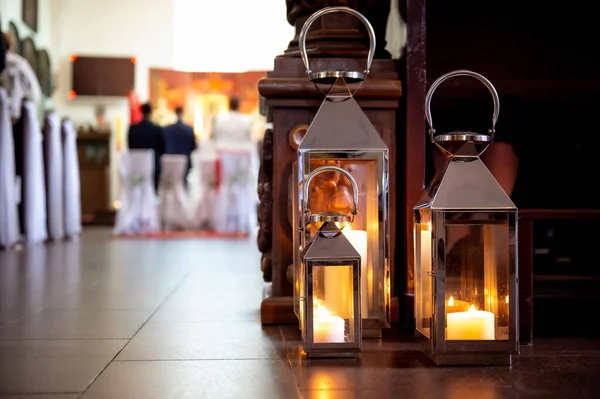 interiors and details in catholic church old catholic church interior view towards the altar with lanterns in the foreground