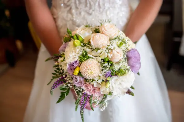 flowers bouquets bouquets and boutonnieres bouquet of flowers in the hands of the bride