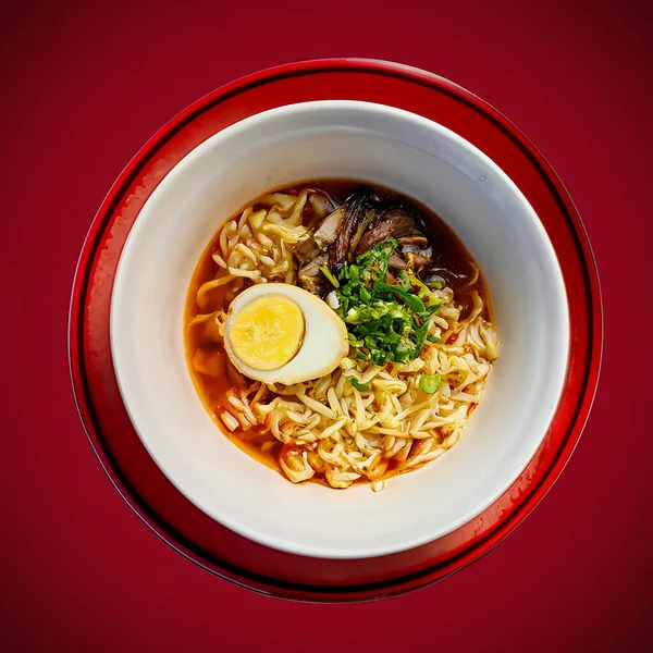 Ramen, Japan food on plate. isolated on dark red background. View from above. selective focus.