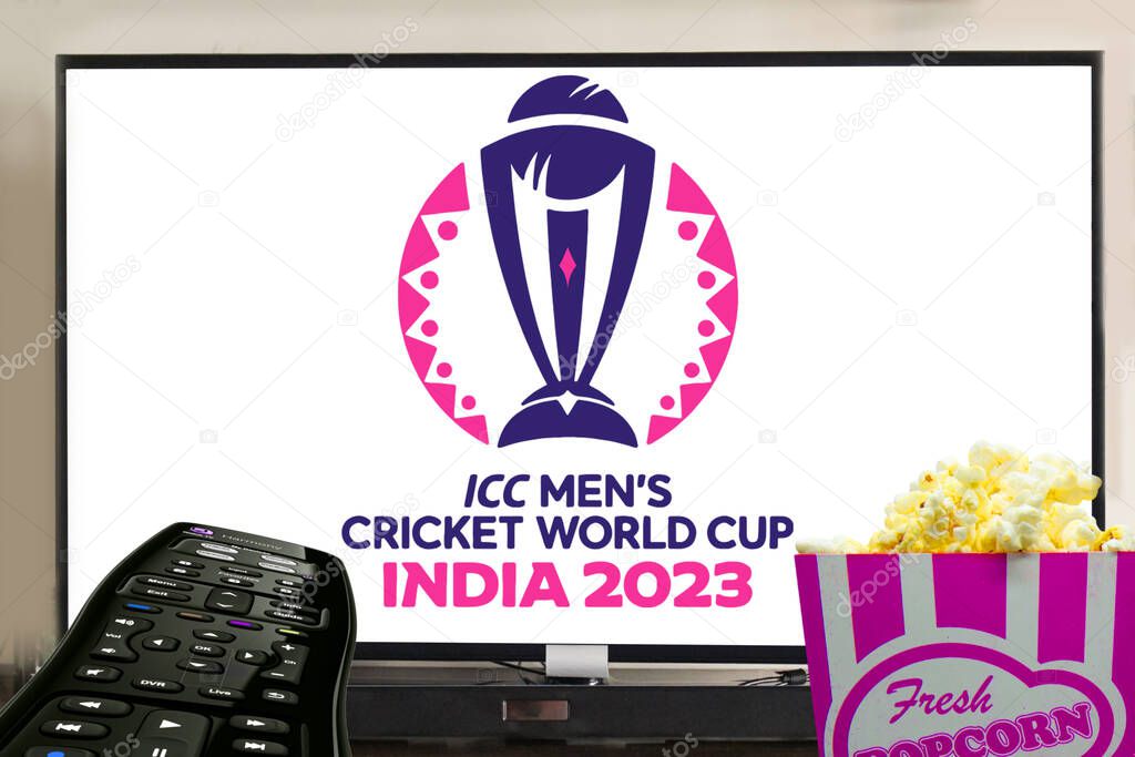 ICC men's cricket world cup 2023 logo displayed television with popcorn in front. entertainment with cricket concept.