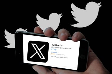 Twitter X app in mobile screen and twitter bird logo in black background. clipart