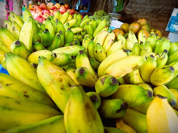 Stock image  Vibrant Bunch of Green Bananas ln local market stall. 