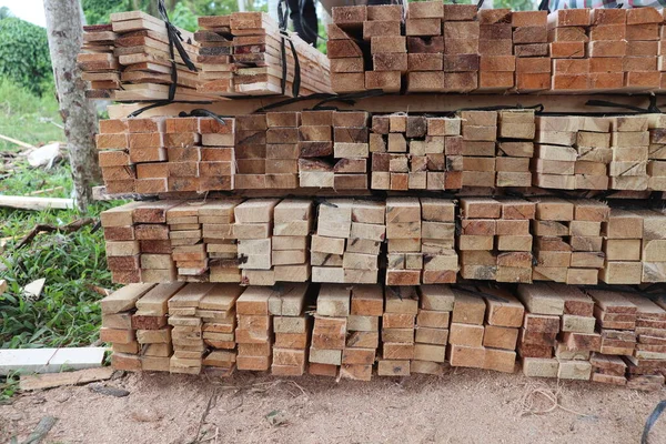 stock image Wood in Sawmill refers to the wood that has been cut and ready to be processed in a sawmill factory, the wood is then processed through various stages to be converted into smaller pieces of wood with the desired size and shape and shape