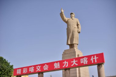 A towering statue of Mao Zedong in downtown Kashgar, Xinjiang, China. High-quality photo