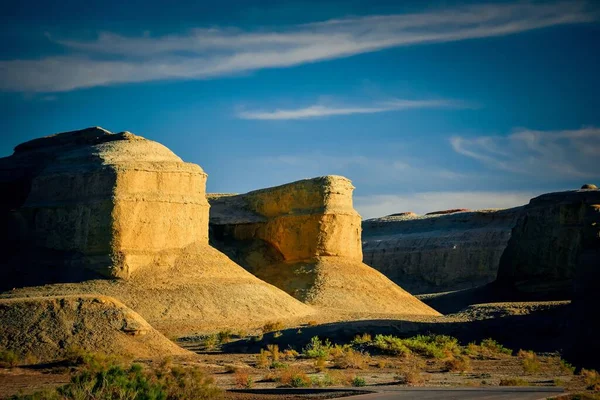 Located beside China National Highway 217 from Karamay to Burqin County, the Ghost City is a typical Yardang landform. The huge stone pillars of varied shapes in the Gobi make magnificent scenery. The Ghost City is also known as \