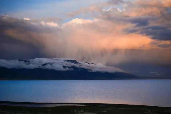 Sayram Lake features transparent water with changing colors, snow-covered mountains, numerous kinds of wildflowers as well as breathtaking sunrise and sunset, which together make for some of the most spectacular sights on earth.