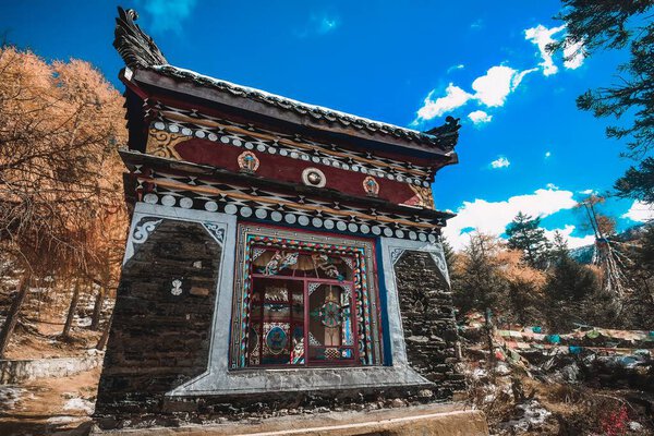 The small houses sheltering the water wheel and turning the prayer wheel are very gorgeous