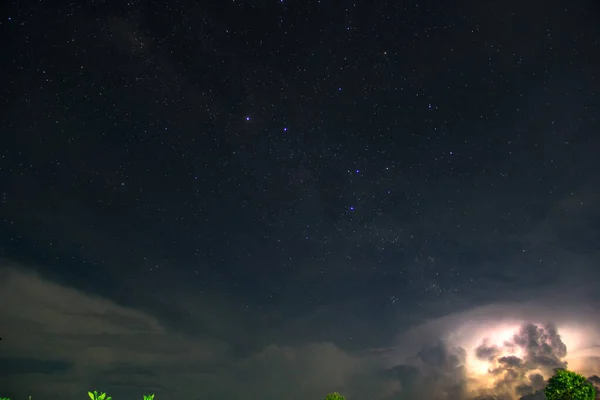 starry night view with storm clouds. starry night sky