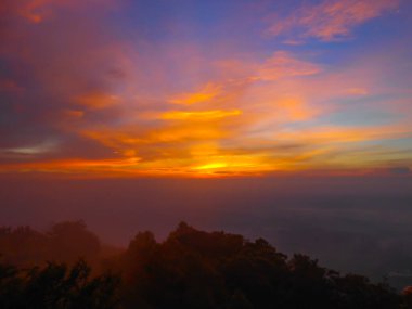 Dramatic sunsets and sunrise skies. Orange, yellow and blue colors sunset. Panoramic view