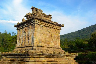 the historical building of the Gedong Songo temple which is exposed to the morning with the blue sky