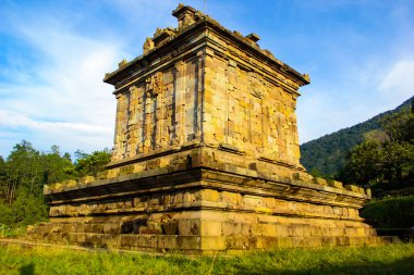 the building of the Gedong Songo temple which is exposed to the morning sun and blue sky