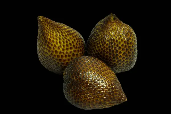 Close-up of Zalacca or snake fruit isolated on black background, clipping path included