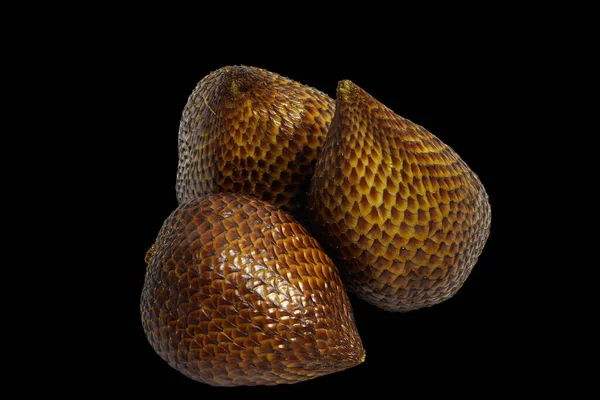Tropical delight of Snake Fruit isolated on black background with clipping path