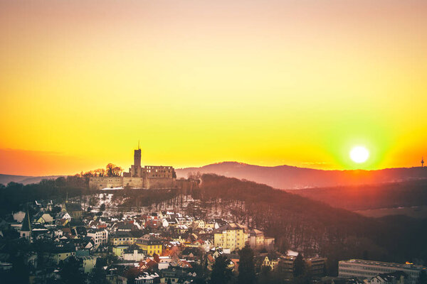 Knigstein im Taunus near Frankfurt. View of the castle ruins after the sunset. Illuminated castle and village in winter