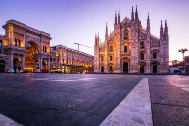 Milan Cathedral in sunrise, the sun breaks at the dome to a sun star. beautiful and almost deserted clipart