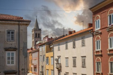 Streets, alleys and buildings of a historic Mediterranean old town on the Mediterranean Sea. A sunny day in the coastal town with a port on the Adriatic Sea, Zadar, Dalmatia, Croatia clipart