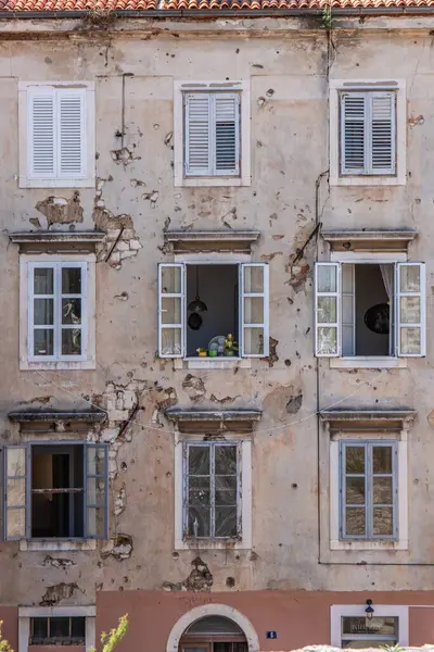 Stock image Window of an old building showing bullet holes from the Balkan War. Window front or house front in the historic old town of Zadar, Adriatic Sea, Dalmatia, Croatia