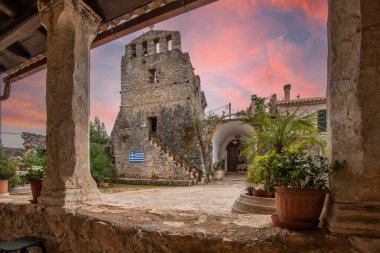 Great typical Greek monastery walls. Ruins in the Mediterranean architectural style of Greece. Sunset on Anafonitria monastery, Ionian Islands, Greece clipart