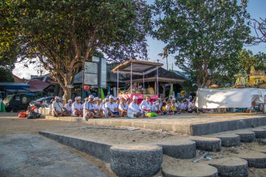  ceremony on the beach. Religious ceremony of Hindu faith on the beach of Sanur, Bali, Indonesia clipart