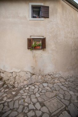 Old, historic, dreamy mountain village. Narrow streets, old houses in a romantic setting. Beautifully landscaped place with small paths and squares Moenice, Moscenicka Draga, Istria, Croatia clipart