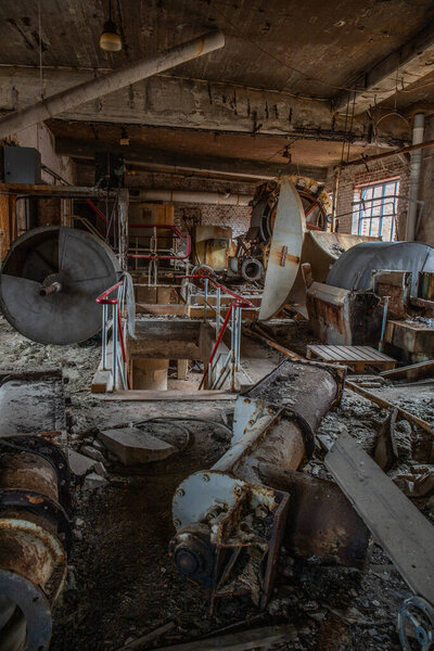 Old abandoned paper factory. Historical and typical factory building as a lost place. Riots and decay take a toll on the substance. Original machines and objects can be found here in Sweden