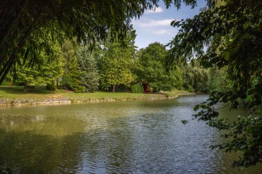 Park and gardens in a Krishna temple. Landscape of Krisna-vlgy IKKB park in Hungary clipart