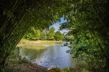 Park and gardens in a Krishna temple. Landscape of Krisna-vlgy IKKB park in Hungary clipart